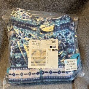 Woman Within Blue and White Geometric Vest